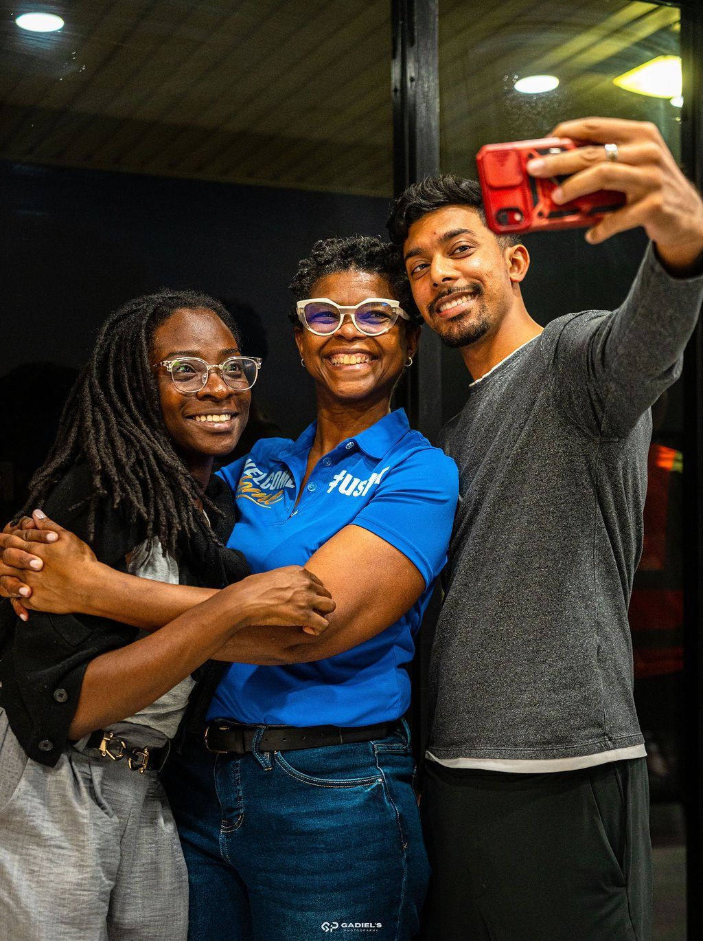 Friends taking a selfie with a greeter